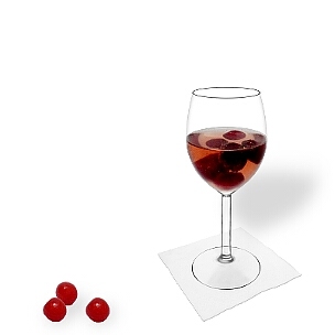 Cherry Punch served in a red wine glass, the common way of presenting that delicious party mixture.