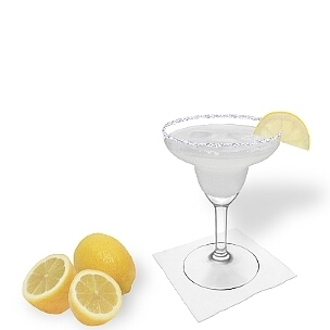 Margarita served in a Margarita glass with a slice of lemon and a sugar or salt rim, the common way of presenting that refreshing tequila cocktail.