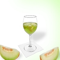 Melon punch in a red wine glass.