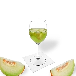 Melon Punch served in a red wine glass, the common way of presenting that delicious party mixture.