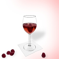 Raspberry punch in a red wine glass.