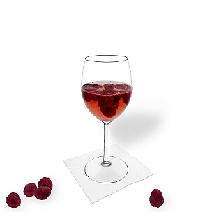 Raspberry Punch served in a red wine glass, the common way of presenting that delicious party mixture.